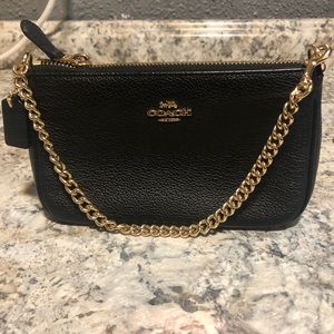 Black leather Coach wristlet bag